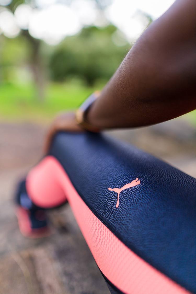 Close up of blue and pink Puma leggings with a pink Puma logo