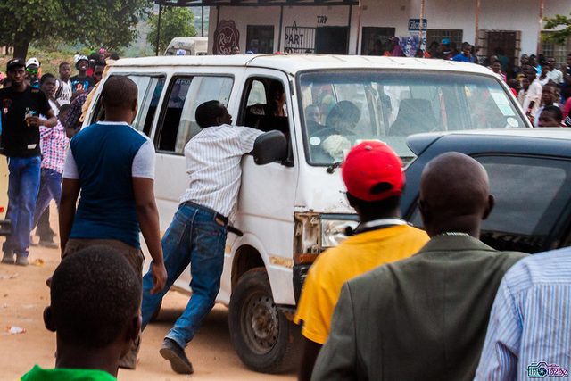 Men trying to stop the driver (at least that's what it looked like)